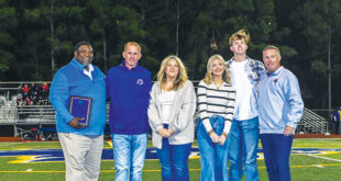 Dew family honored with plaque during halftime